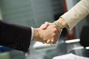 Man and woman shaking hands